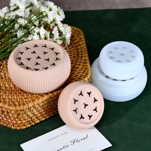 Macro view of a round silicone floral stem holder with vertical ribbed texture and holes
