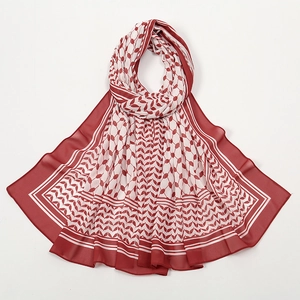 Detailed pattern of vintage red and white printed chiffon scarf on white background