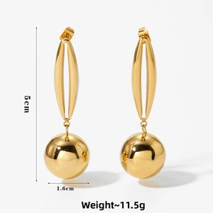 Detailed view of hollow sphere gold earrings with 5cm length and mirror finish