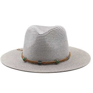 Detail of light gray straw fedora with bohemian braided band and emerald beads