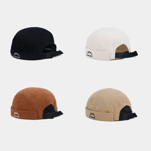 Detail of Miki hats with mountain embroidery and adjustable plastic buckle closure