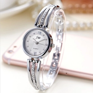 Elegant silver women's quartz watch with rhinestone steel band and Roman numerals