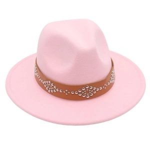 Detail of pink wool felt fedora hat featuring a brown leather band with silver rivets