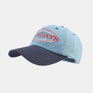 Two-tone denim baseball cap with Sunday's Running Club embroidery on a grey background