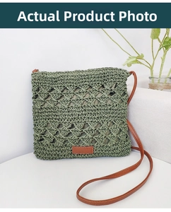 Detail of green hollow-out paper rope woven bag with a brown leather shoulder strap