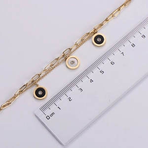Detailed view of 18k gold plated double-layer bracelet showing 1.2cm pendant scale