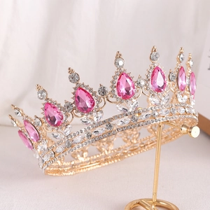 Macro view of gold bridal crown with pink teardrop crystals and silver rhinestones