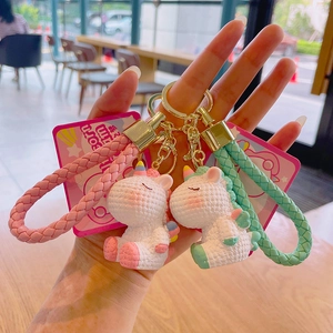 Cute cartoon unicorn keychain set with woven texture and leather hand strap in soft colors