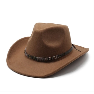 Close-up of deep brown wool felt cowboy hat featuring ethnic braided band and bronze studs