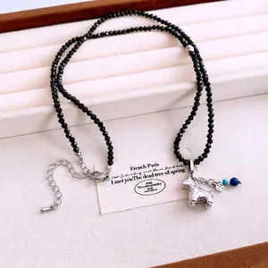 French vintage style black beaded necklace with a silver horse pendant and lobster clasp