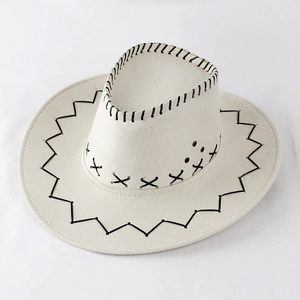 Detail of cream Western cowboy hat with black decorative hand-stitching and ventilation