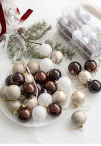 Detail of mixed champagne and chocolate Christmas balls with diverse finishes and textures