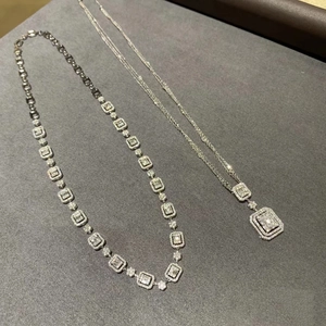 Detailed view of luxury platinum-plated tennis necklace with square-cut diamond clusters
