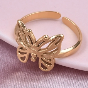 Close-up of rose gold butterfly ring on silk background highlighting cutout details