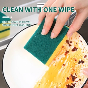 Dual-sided kitchen sponge cleaning grease from a ceramic bowl with high efficiency