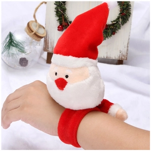 Close-up of plush Santa Claus snap bracelet worn on wrist with festive holiday background