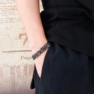 Retro punk stainless steel men's chain bracelet with vintage silver finish on wrist