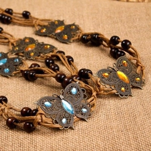 Bohemian braided waist belt with wooden beads and bronze butterfly pendant for women