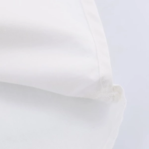 Close-up of the delicate white poplin fabric texture on a fashion women shirt