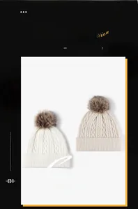 Detailed cable knit pattern on white and beige winter beanies with faux fur pom poms
