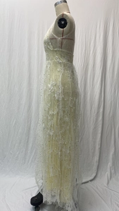 Close-up of floral lace embroidery and sequin details on ivory sleeveless wedding gown