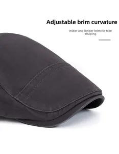 Detail of dark grey cotton ivy cap showing adjustable curved brim and twill texture