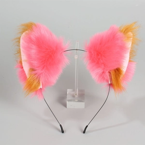 Close-up of pink and brown plush fox ears on a thin black metal headband