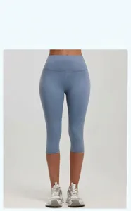 Close-up of blue high-waisted yoga capri pants with tight-fitting peach lift fabric