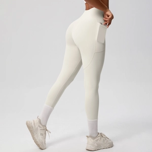 Detail of high-waisted off-white yoga leggings featuring a functional side phone pocket