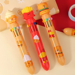 Close-up of cute cartoon ice cream, fries, and burger bear tops on multi-color ballpoint pens