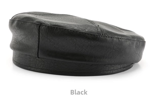 Close-up of black PU leather octagonal cap showing fine stitching and smooth texture