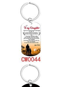 Detail of dog tag keychain with father and daughter silhouette and inspiring quote