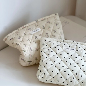 Quilted corduroy cosmetic bags with floral and heart patterns for organized storage