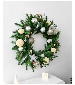 Detail of a 60cm Christmas wreath with silver ornaments and glowing LED lights