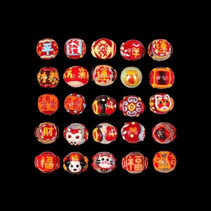 Macro display of 25 unique hand-painted glass beads with Chinese lucky characters
