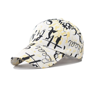 Detail of white cotton baseball cap with yellow graffiti and black letter printing