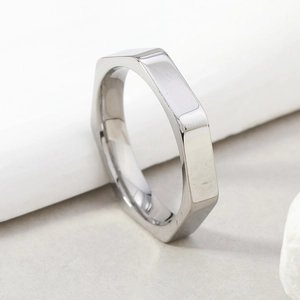 Minimalist silver 4mm hexagonal stainless steel ring with geometric faceted design