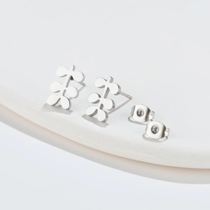 Minimalist silver geometric stud earrings featuring the Chinese characters for Future