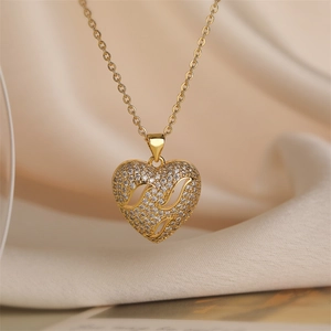 Macro detail of gold-plated hollow heart pendant with sparkling pavé rhinestones