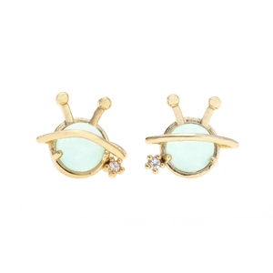 Close-up of 925 silver space-themed earrings with green stones and sparkling crystals