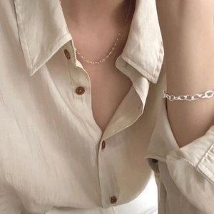 Minimalist S925 silver gold necklace and textured silver chain bracelet on model