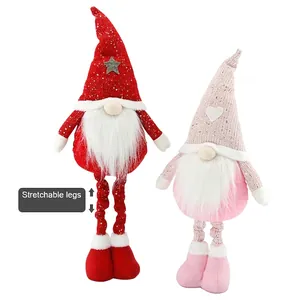 Christmas plush gnome with stretchable legs and heart pattern on a white background