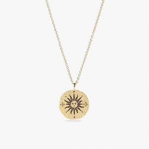 Golden sun face coin necklace with hammered texture and small inlaid gemstones