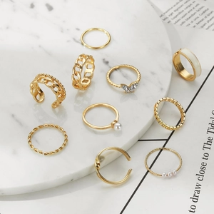 10-piece vintage gold ring set featuring pearls, butterfly motifs, and chain textures