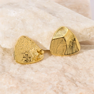 Golden triangle stud earrings with leaf texture and hammered finish on crystal stones