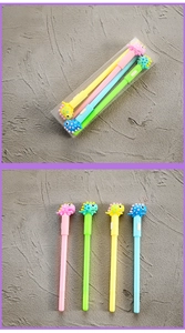 Detailed view of four colorful cartoon dinosaur gel pens in original packaging