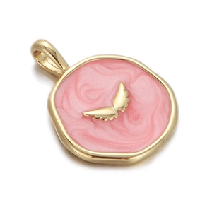 Macro detail of gold-plated pink enamel pendant with golden wing motif and textured finish