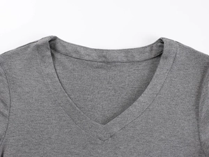 Close-up of the V-neckline and fine stitching on the gray slim-fit knitted T-shirt