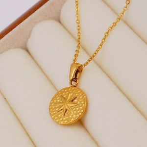 18K gold-plated stainless steel round medallion necklace with embossed North Star