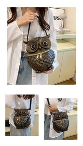 Detail of owl-shaped crossbody bag featuring textured feathers and dual gold zippers